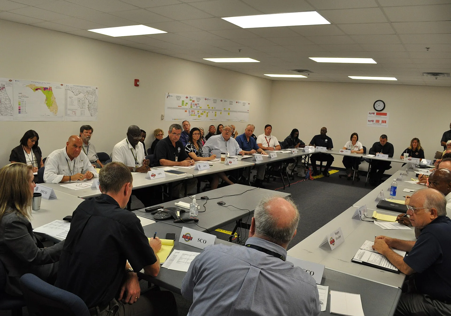 The original database describes this as: Title: Morning Briefing at the Joint Field Office Production Date: 07/23/2012 Caption: Tallahassee, Fla. , July 23, 2012 -- Every morning the Unified Command Group meets to brief all senior staff concerning the status of the various divisions. FEMA and the St